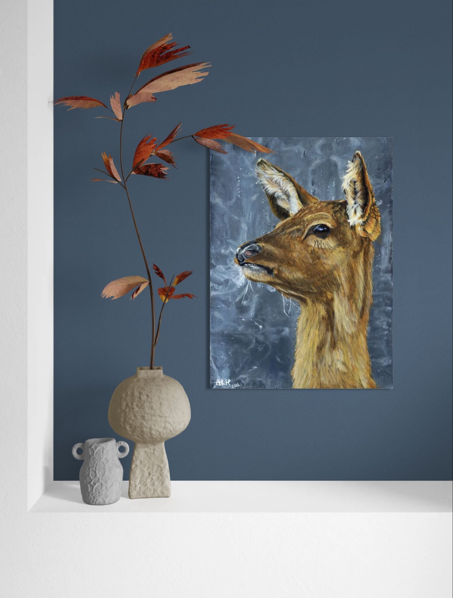 Wall mockup of the original acrylic painting "Frozen in Time" by Abigail Hemmings, showing a startled doe with frosty breath against a stormy grey background.